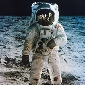 APOLLO 11: BUZZ ALDRIN. Astronaut Edwin Buzz Aldrin standing on moon. Neil Armstrong and Eagle reflected in his visor, 20 July 1969