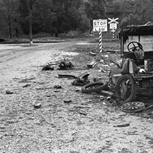 ARKANSAS: ROADSIDE, 1935. An abandoned automobile in front of a railroad crossing