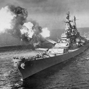 The battleship U. S. S. Missouri bombards Chong Ji, Korea, with 16-inch guns in October 1950