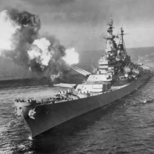 The battleship U. S. S. Missouri bombards Chong Ji, Korea, with 16-inch guns in October 1950