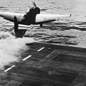Catapulted by Jet Assisted Take-off (JATO), a carrier based Grumman TBF Avenger of the U. S. Navy takes off over the Pacific Ocean during World War II