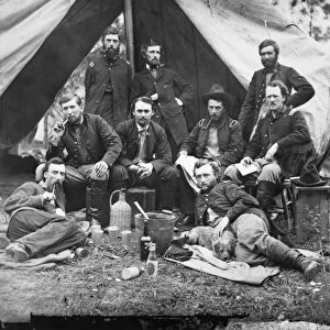 CIVIL WAR: CUSTER, 1862. The staff of General Fitz-John Porter; reclining: Lieutenants William G. Jones and George A. Custer, at the Peninsula, Virginia, 20 May 1862. Photographed by James F. Gibson