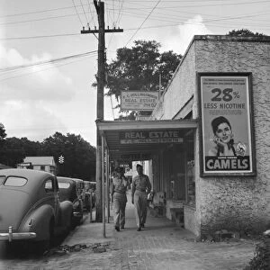 FLORIDA, 1941. American servicemen on the street in Starke, Florida. Photograph, 1941