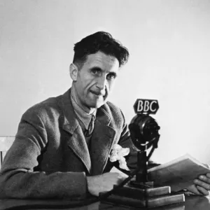 GEORGE ORWELL (1903-1950). Pseudonym of Eric Blair. English novelist and essayist. Orwell broadcasting over the BBC in London, England, in 1943