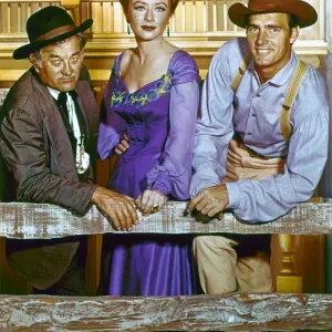 GUNSMOKE, c1960. Cast members Milburn Stone, Amanda Blake, and Dennis Weaver in a publicity photograph for the television series Gunsmoke, c1960