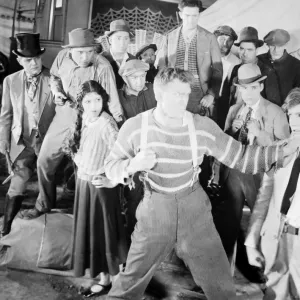 THE HAPPY WARRIOR, 1925. Andreas Randolph, Malcolm MacGregor, Olive Borden, Jack Henrick, William Dunn, and Gardener James in a scene from the film