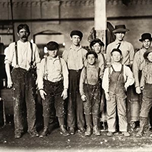HINE: CHILD LABOR, 1909. Doffer boys with a supervisor at the Bibbings Manufacturing