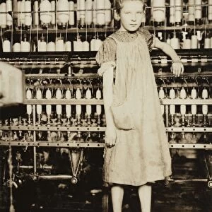 HINE: CHILD LABOR, 1910. A young spinner at a cotton mill in North Pownal, Vermont