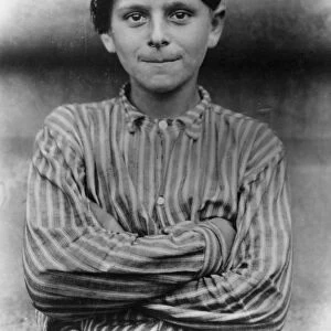 IMMIGRANTS: ELLIS ISLAND. An immigrant boy at Ellis Island, c1900