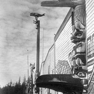 KWAKIUTL VILLAGE, c1914. A Kwakiutl village with totem poles at Alert Bay, British Columbia