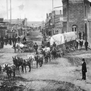 MONTANA: HELENA, c1870. A covered wagon, drawn by a team of mules, on Main Street in Helena