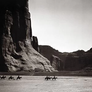NAVAJOS: CANYON DE CHELLY, 1904. Navajo Native Americans on horseback in the Canyon de Chelly, Arizona. Photographed by Edward S. Curtis in 1904