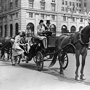 NYC: SERVICEWOMEN, c1940. French servicewomen with a horse and carriage near Central