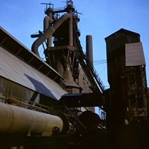 STEEL MILL, 1941. Blast furnace at the Carnegie-Illinois Steel Corporation mill in Etna