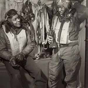 TUSKEGEE AIRMEN, 1945. William Campbell (left) and Thurston Gaines, Jr. of the Tuskegee Airmen 332nd Fighter Group at Ramitelli Airfield, Italy, March 1945. Photograph by Toni Frissell
