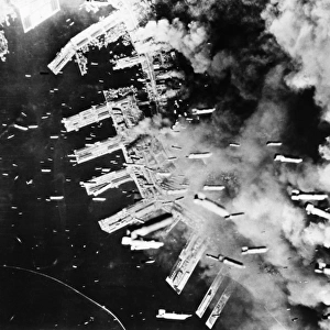 U. S. B-29 bombers drop thousands of bombs on Kobe, Japan, during World War II, May-June 1945