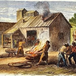 UNION ARMY FORGE, 1864. Blacks working in a Union Army forge during the American Civil War. Colored wood engraving from February 1864