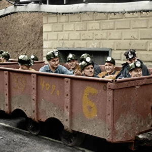 WEST VIRGINIA: COAL MINE. The next trip. Coal miners sitting in a mining car