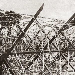 WORLD WAR I: BARBED WIRE. Formidable wire entanglement with a frame of steel bars