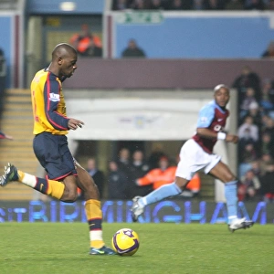 Abou Diaby shoots past Aston Villa goalkeeper Brad