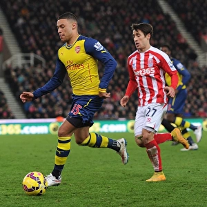 Alex Oxlade-Chamberlain's Sneaky Move: Outsmarting Bojan in the Stoke City vs. Arsenal Clash (2014-15)