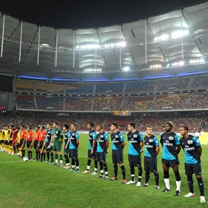 The Arsenal and Malaysia team line up before the match. Malaysia XI 0: 4 Arsenal