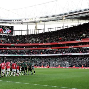 The Arsenal and Plymouth players shake hands before the match