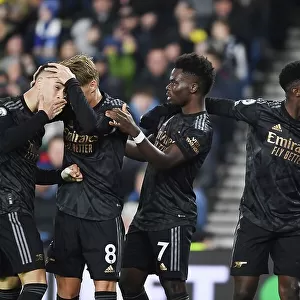 Arsenal's Martinelli, Odegaard, Saka, and Nketiah: Celebrating a Win Against Brighton