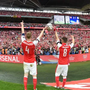 Arsenal's Per Mertesacker and Aaron Ramsey Celebrate FA Cup Victory