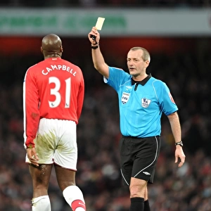 Arsenla defender Sol Campbell is shown the yellow card by referee Martin Atkinson