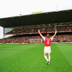 Captain Tony Adams salutes the North Bank before his 500th league match for Arsenal