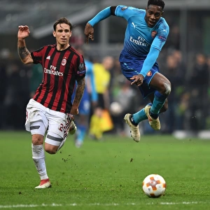 Danny Welbeck vs. Lucas Biglia: Clash in the UEFA Europa League Round of 16 between AC Milan and Arsenal