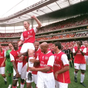 Dennis Bergkamp is chaired by Patrick Vieira and Thierry Henry and the rest of the Arsenal Legends