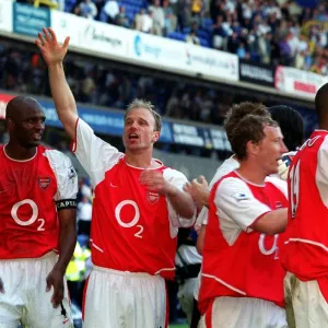 Dennis Bergkamp and Patrick Vieira celebrate winning the league