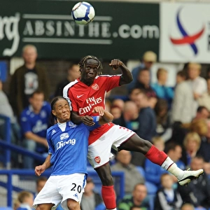 Dominance on the Pitch: Sagna and Pienaar Clash in Arsenal's 6-1 Victory over Everton, 2009