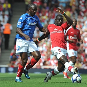 Emmaniuel Eboue (Arsenal) John Utaka (Portsmouth)
