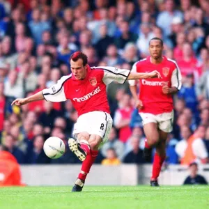 Fredrik Ljungberg shoots past Chelsea goalkeeper Carlo Cudicini to score the 2nd Arsenal goal