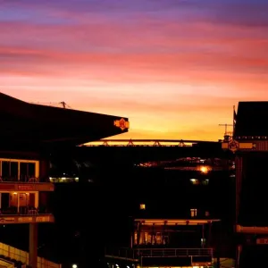 The Sun sets over Emirates and Highbury stadiums Print The Sun sets over Emirates and Highbury stadiums Print