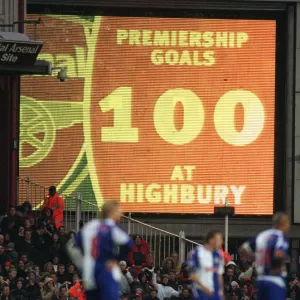 The jumbotron informs the fans that Thierry Henry has scored 100 Premiership goals at Highbury