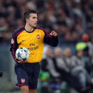 Robin van Persie (Arsenal) and a cameraman