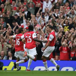 Robin van Persie celebrates scoring Arsenals and his 1st goal with Mathieu Flamini