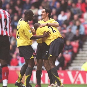 Sol Campbell, Robert Pires and Abu Diaby celebrate the 1st goal