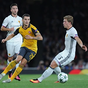 Xhaka vs. Fransson: A Battle for Ball Possession in Arsenal's UEFA Champions League Clash against FC Basel