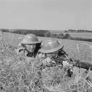 Corporal Bins and a comrade take aim in the countryside