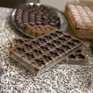 Belgium, West Flanders, Bruges, tray of chocolates and chocolate mould
