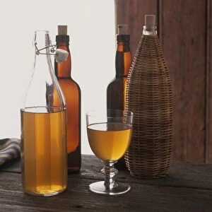 Bottles and glass of home-made cider