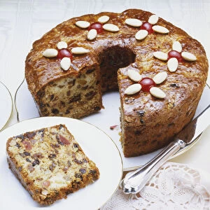 Candied fruit cake, one slice removed, elevated view