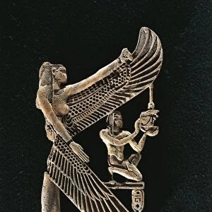 Decorative wooden component: goddess Isis protecting a king who is offering the neb sign, the cartouche shows the name of Pharaoh Sehibra