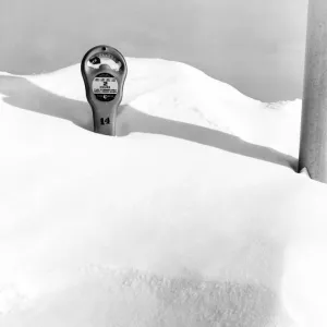 An Expired Parking Meter In The Snow