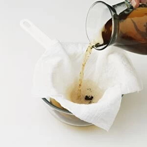 Filtering infused liquid by pouring through muslin cloth